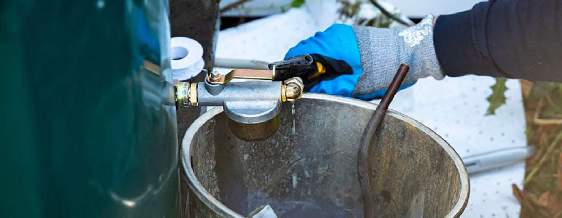 oil tank engineer draining oil tank water contamination